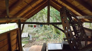 Roundwood timber framed camp kitchen at eco camp site.