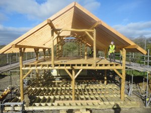 Sunny view of roundwood timber frame.