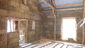Strawbale walls in the roundwood timber frame.